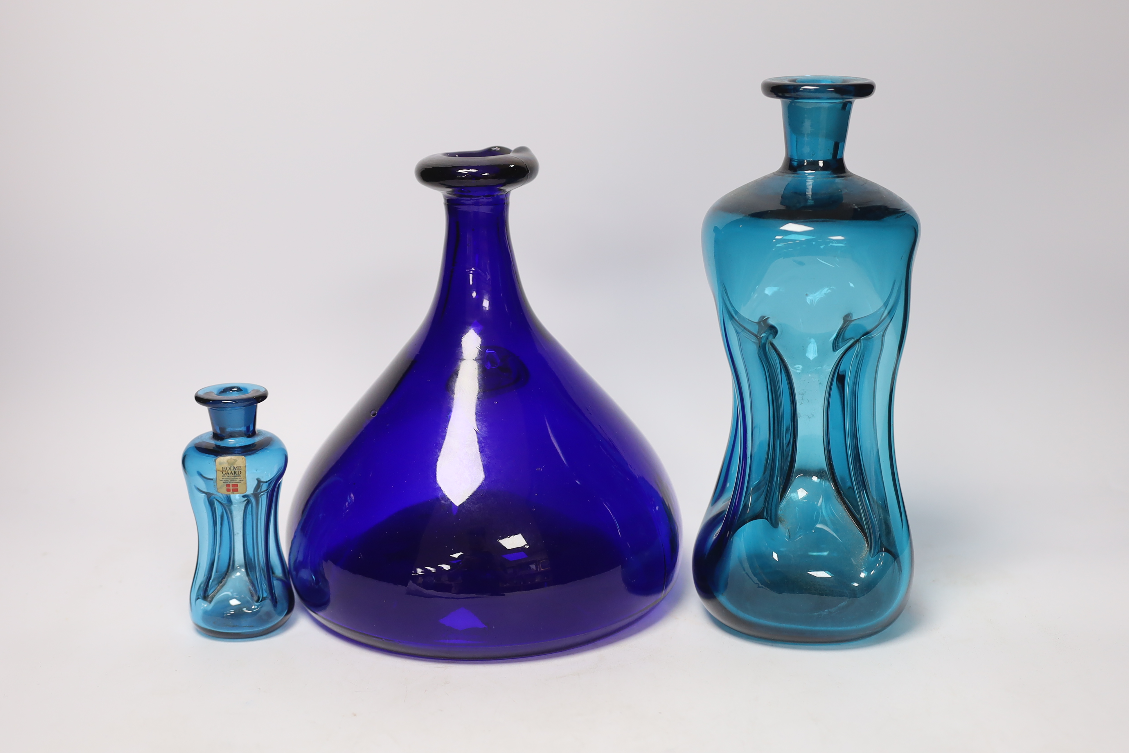 Three Holmegaard blue glass decanters, tallest 26cm high